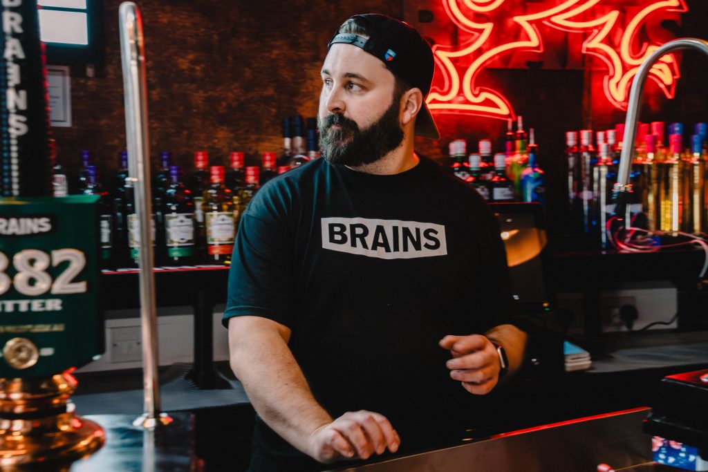 Staff member wearing bras t shirt at Brains The Old Brewery Cardiff