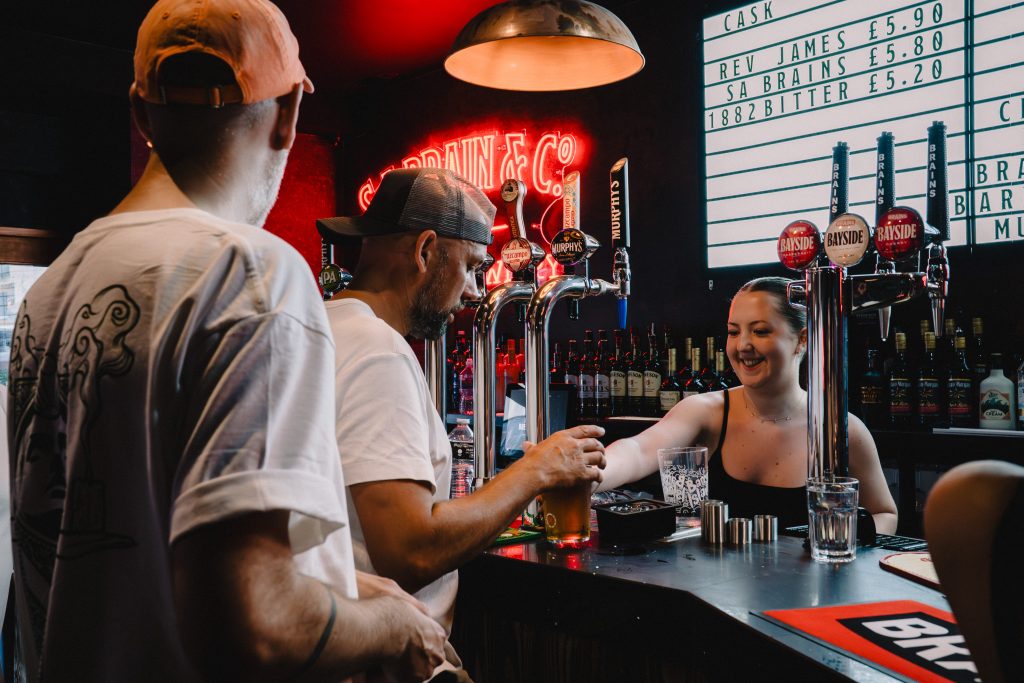 Customers getting served at the Old Brewery Cardiff Brains